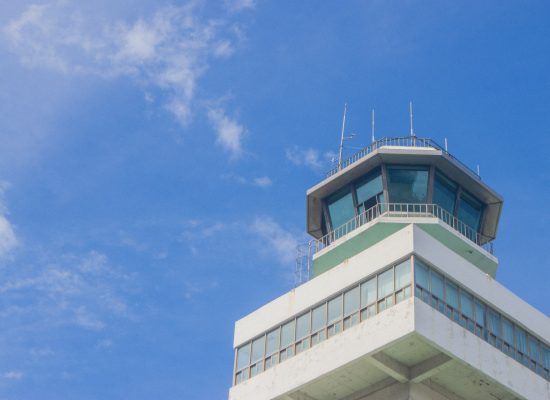 Air traffic control center with operators coordinating multiple simultaneous flights, representing enterprise AI coordination and governance