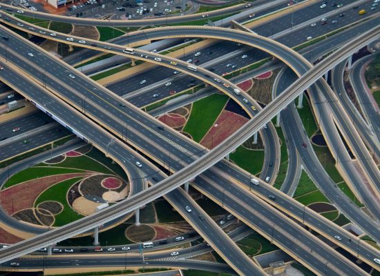 Aerial view of a complex highway interchange representing the challenge of AI project prioritization and building a structured AI portfolio
