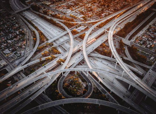 Aerial view of a highway interchange representing the complexity of AI project prioritization and portfolio management across an enterprise.